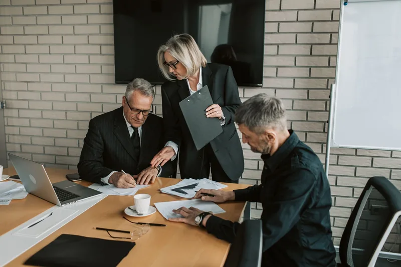 Business team reviewing documents together in a meeting room