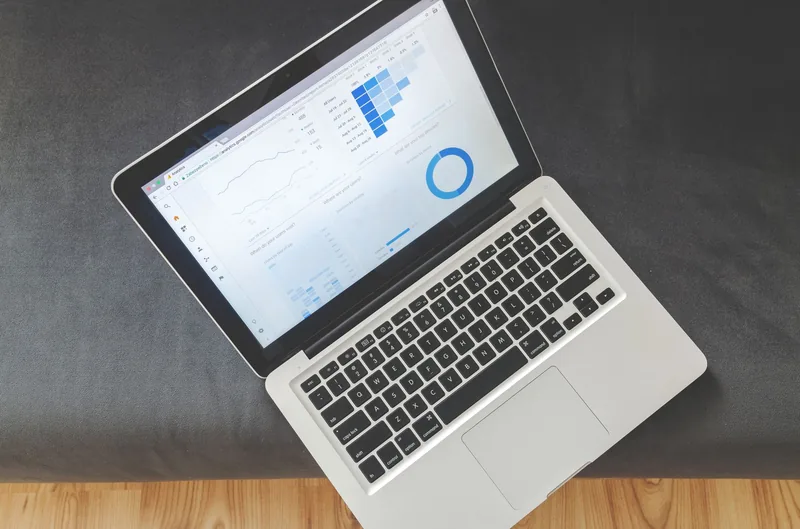 Reviewing email marketing performance and revenue metrics on a laptop