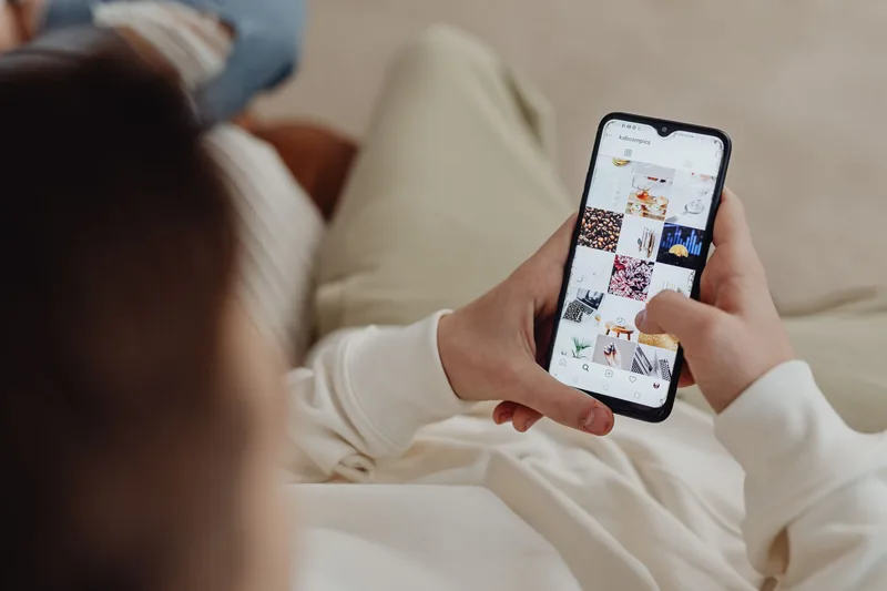 Instagram feed on a phone, where paid ads appear between organic posts