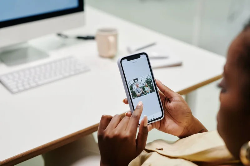 Small-business owner managing a Facebook and Instagram ad campaign on their phone