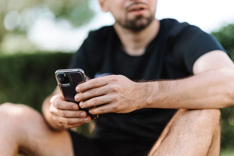 Person booking a gym class on their phone