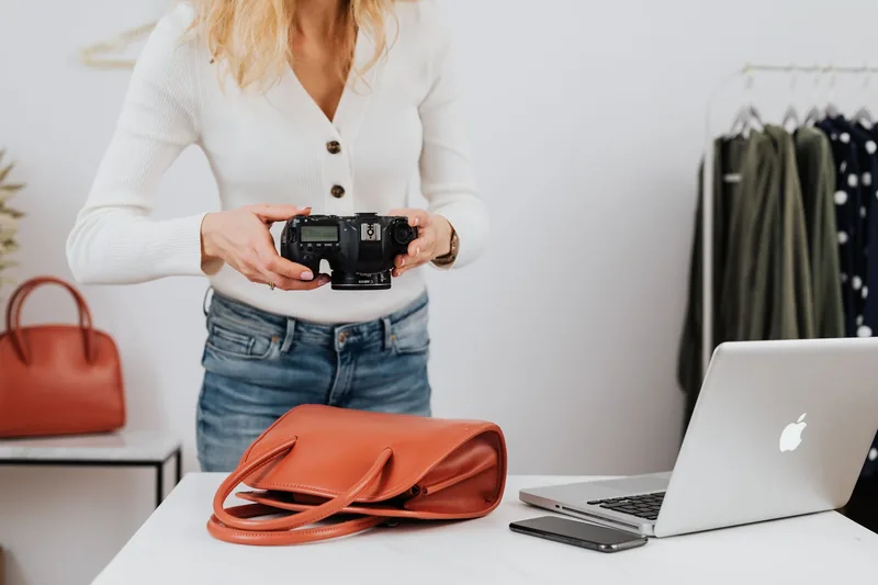 Small business owner photographing a product for social media content