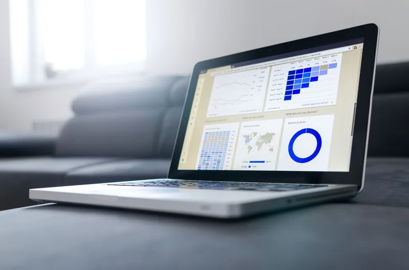 Marketer reviewing social media analytics on a laptop
