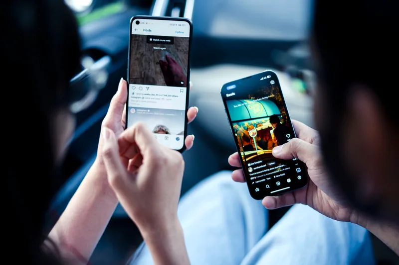 Person browsing Instagram on their smartphone