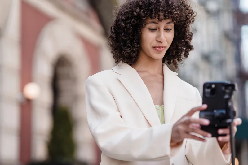 Small-business owner filming a short video reel on a phone