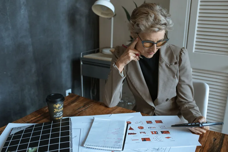 Small-business owner planning a lead generation strategy at a desk