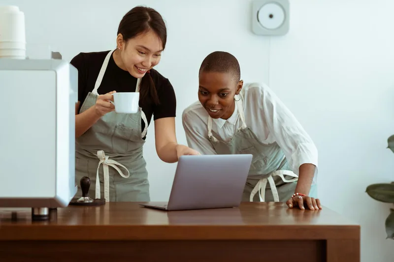 Small business owners working together on a laptop